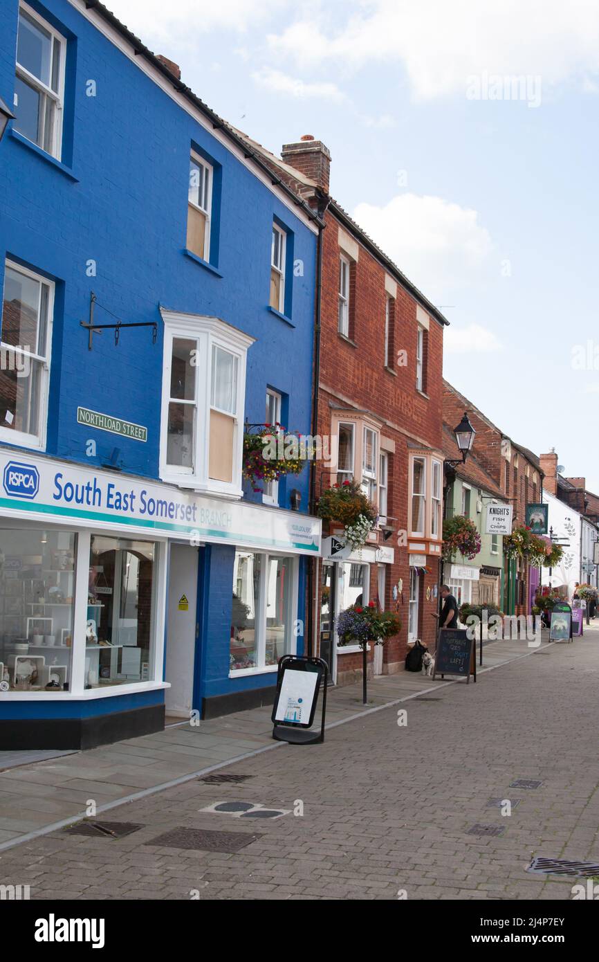 Shops on Northload Street in Glastonbury, Somerset in the UK Stock Photo