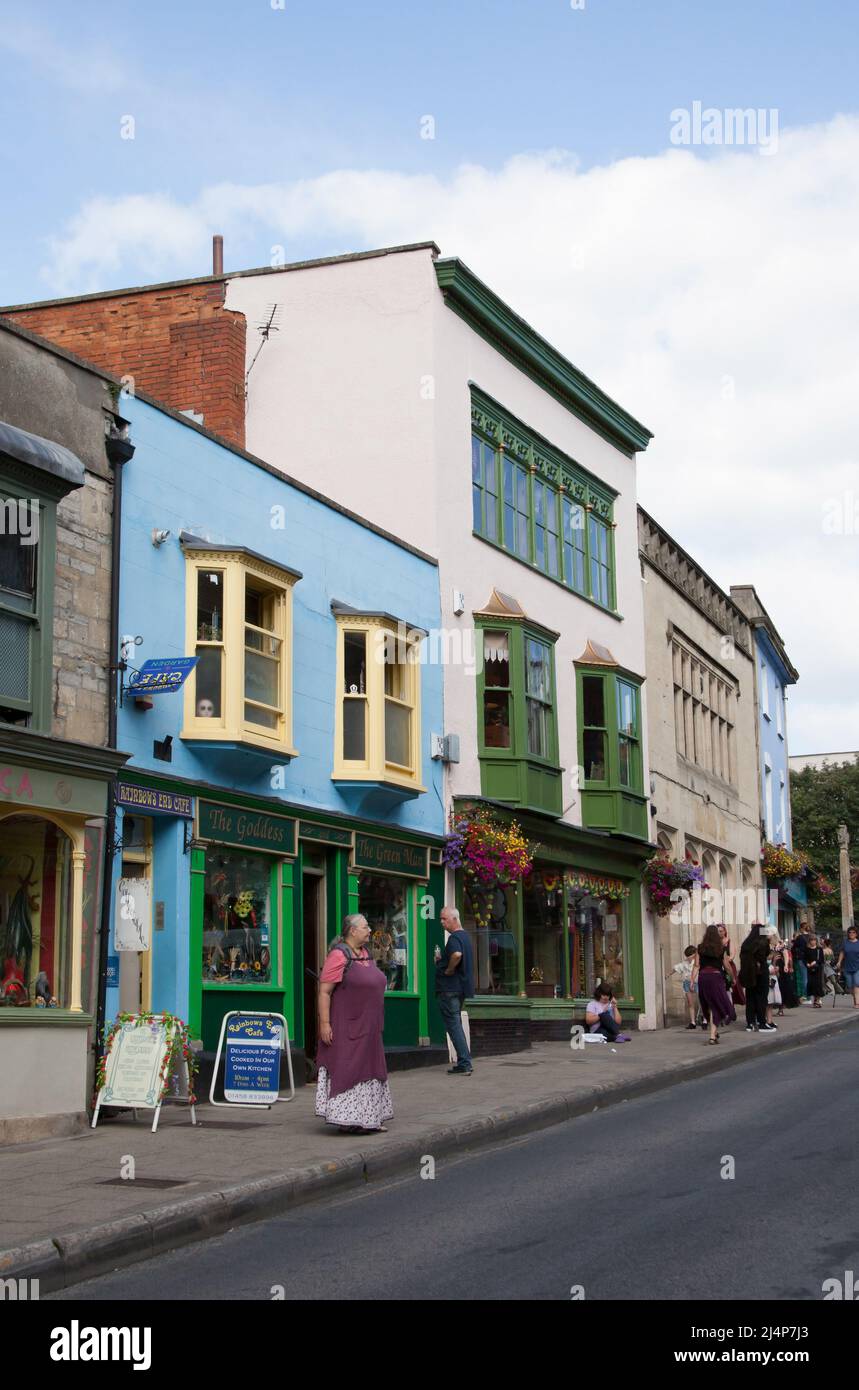 Shops and shoppers on the High Street in Glastonbury, Dorset in the UK Stock Photo