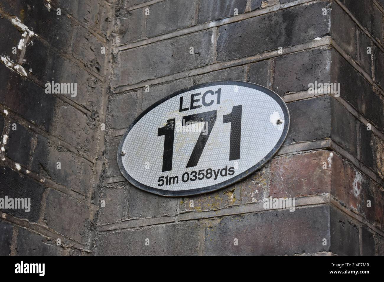 An engineer's line reference plate on the London Euston to Crewe railway line. Stock Photo