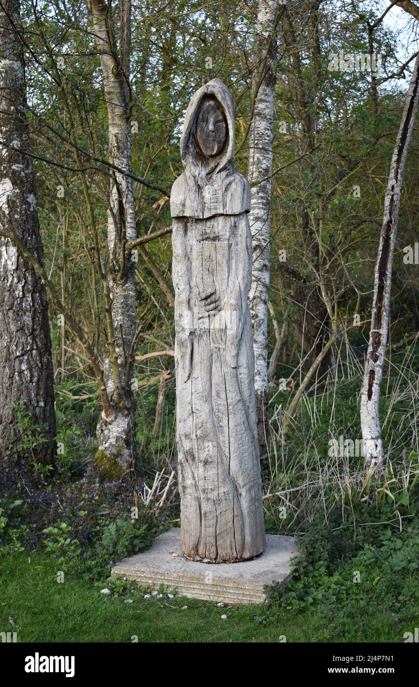 Carved wooden statue of a monk at Bradwell Abbey in Milton Keynes.  The statue has its own Twitter account: @Creepy  Monk Stock Photo