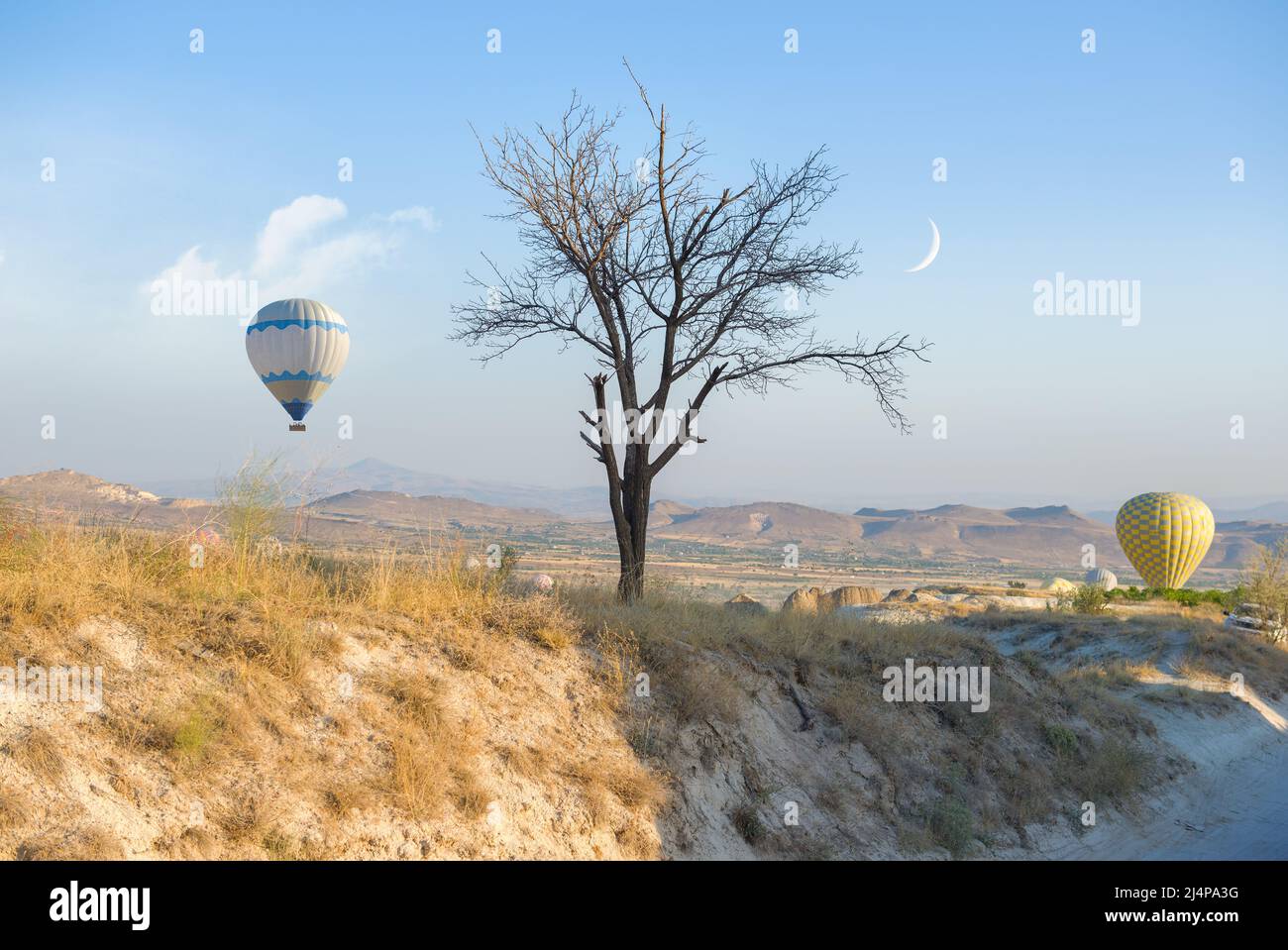 Hot air balloons landing over Cappadocia, Turkey Stock Photo