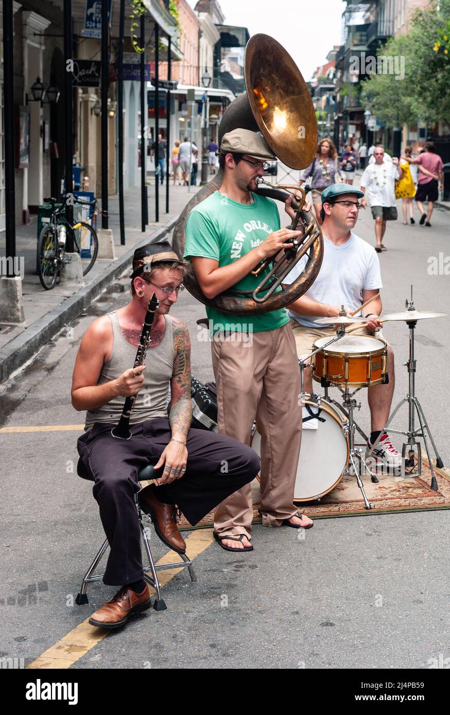 New Orleans, Louisiana, United States - July 17 2009: Jazz Band with Sousaphone, Clarinet, and Drums Playing Outdoors on Bourbon Street. Stock Photo