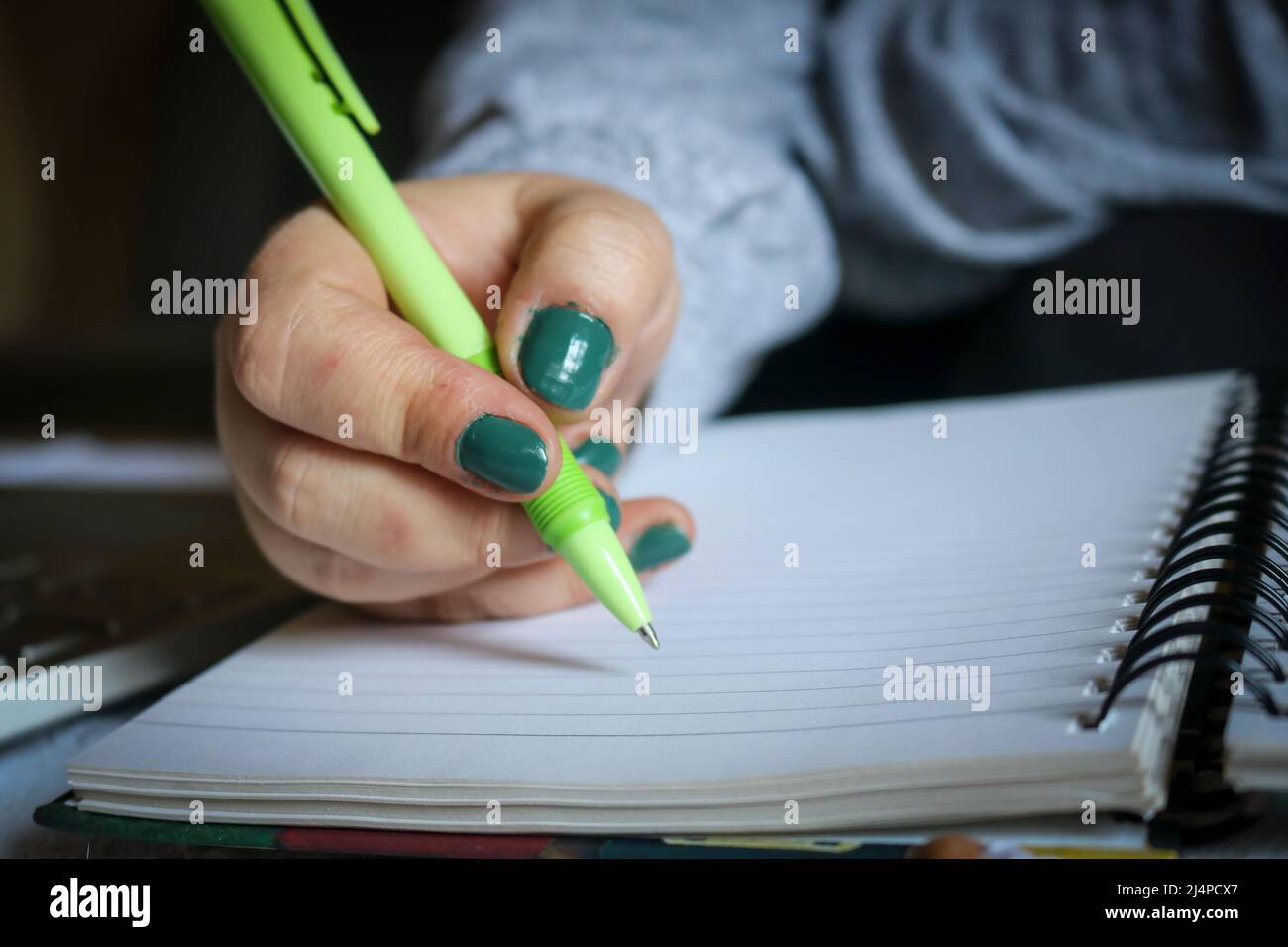 Girl hand holding pen writing hi-res stock photography and images - Alamy