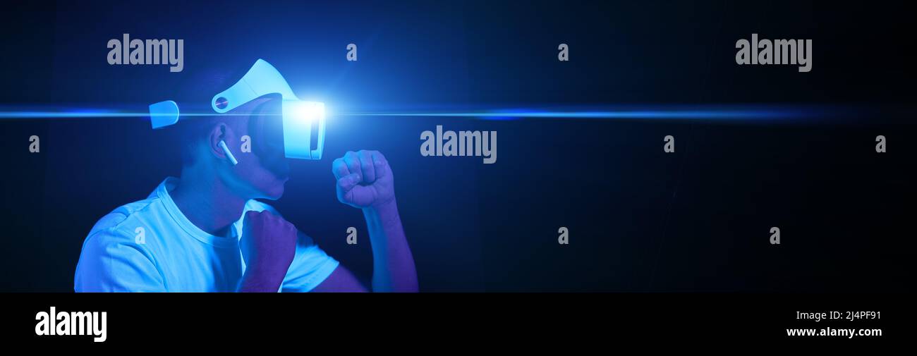 Man with virtual reality headset is playing game and fighting. Concept ...