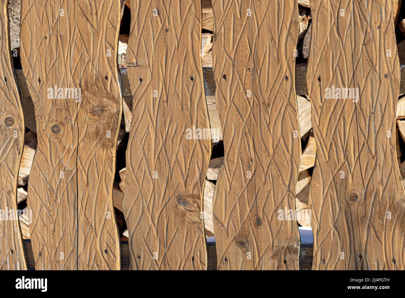 Diverse wooden surface. The walls of the houses are made of wood. Boards for background and construction. Log house in Ukrainian villages. Stock Photo