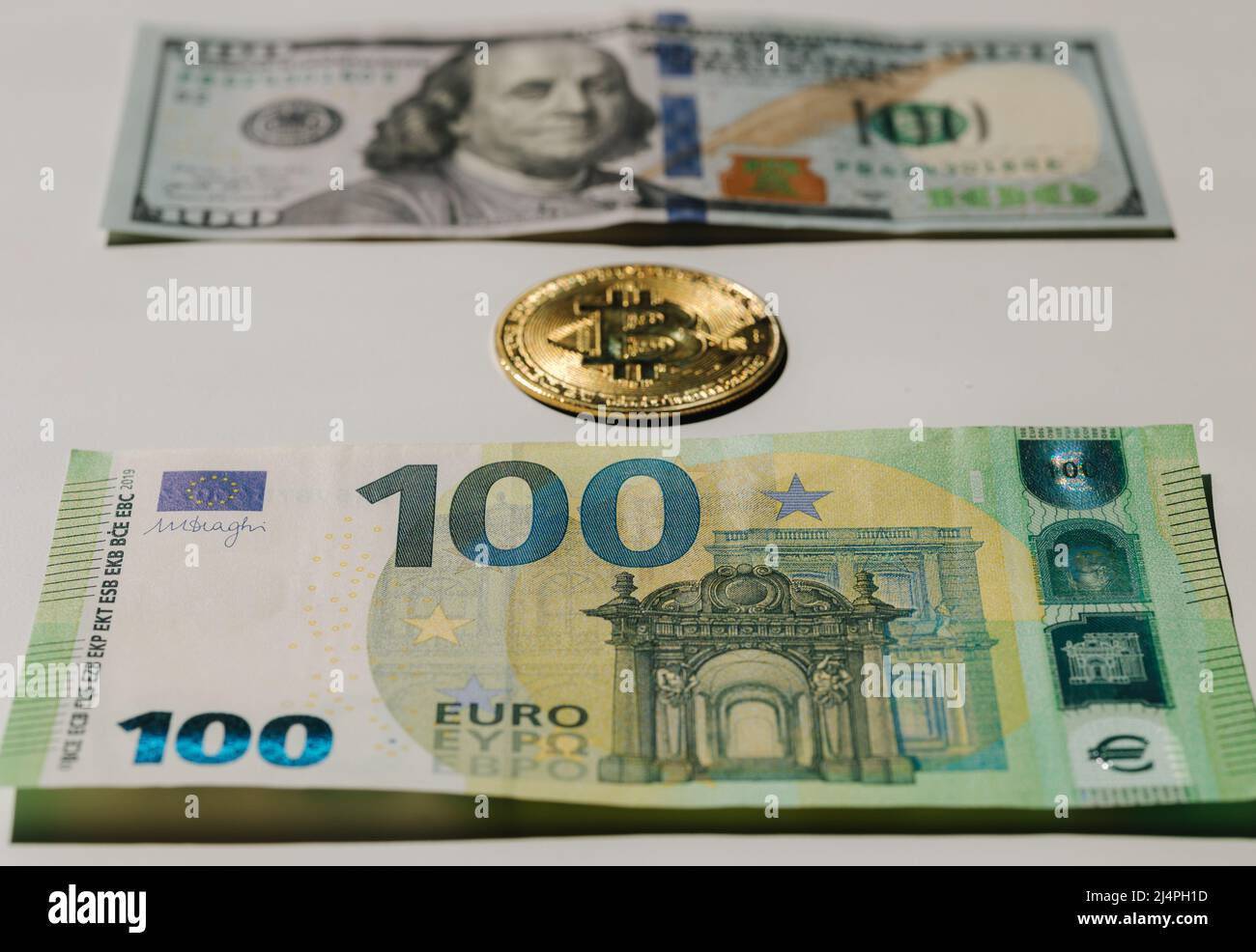 Digital cryptocurrency gold bitcoin lying between US Dollar and Euro  banknotes. Difference between virtual money and cash. Concept of new  virtual Stock Photo - Alamy