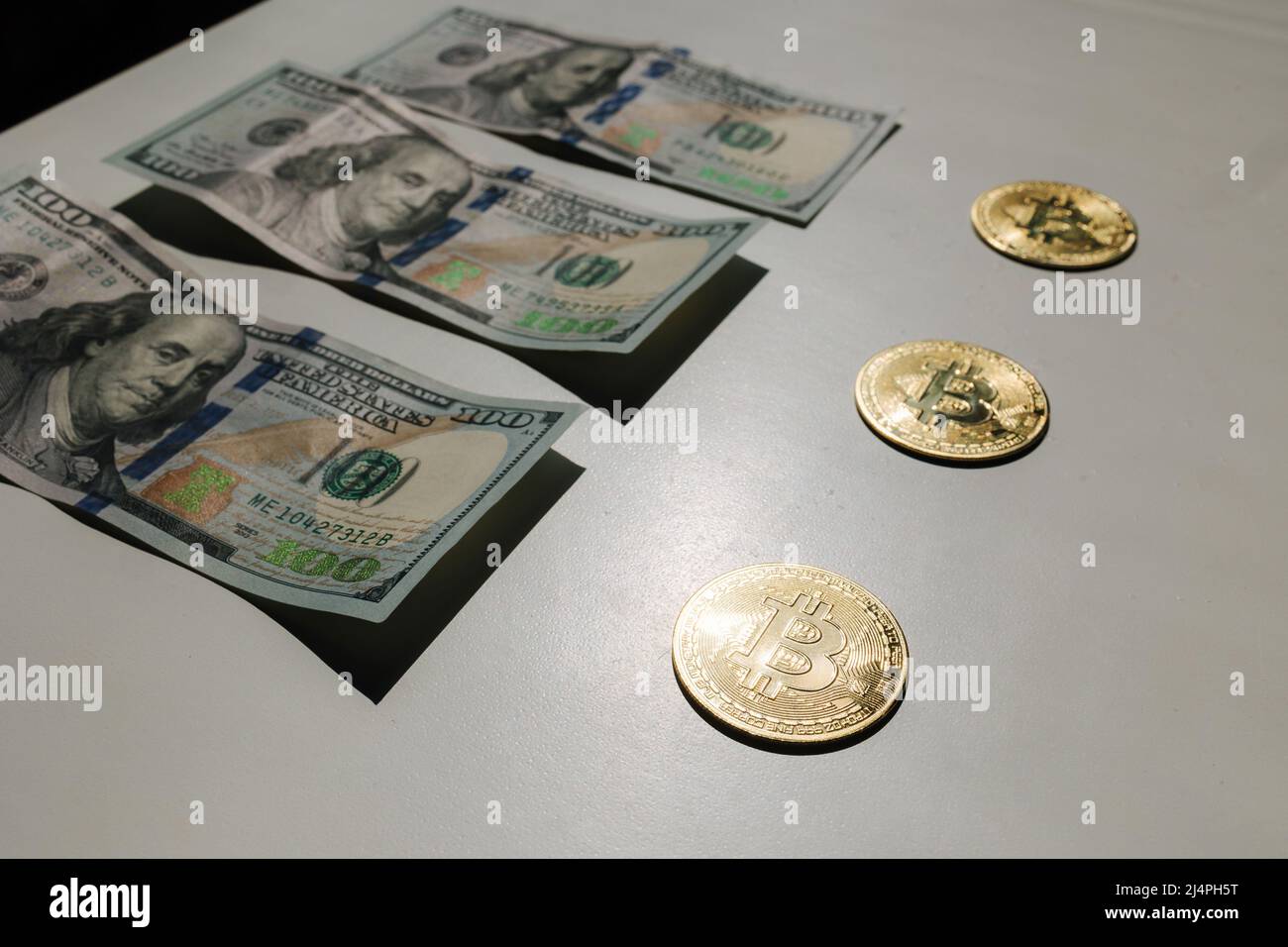 Bitcoin side of banknotes of one hundred dollars. Exchange US dollars for  bitcoin. Cryptocurrency on dollar bills. Digital modern method of payment  Stock Photo - Alamy
