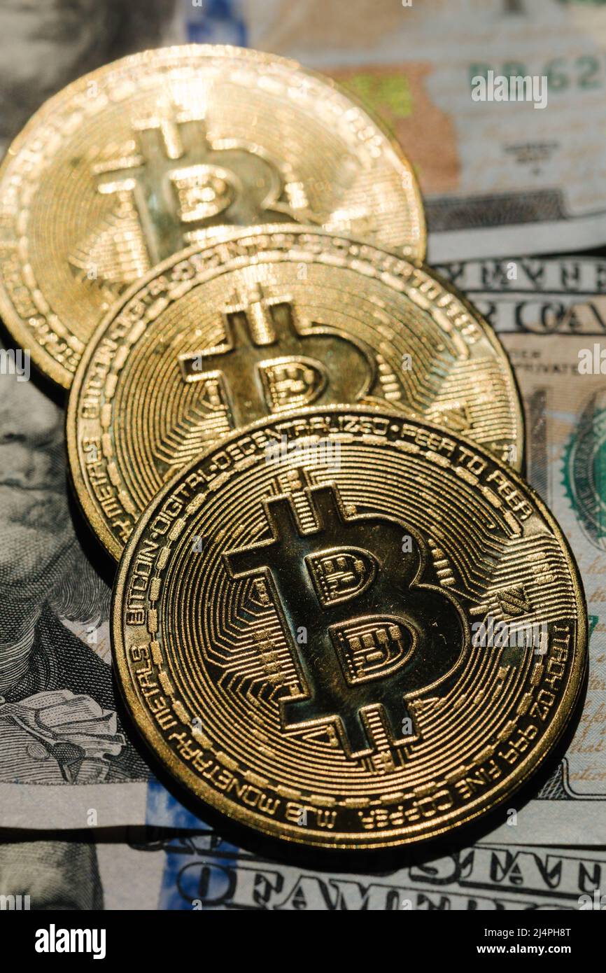 Close-up pf bitcoin on banknotes of one hundred dollars. Exchange US dollars  for bitcoin. Cryptocurrency on dollar bills. Digital modern method of Stock  Photo - Alamy