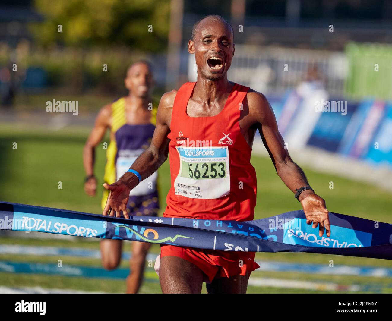Cape Town, South Africa, 16th Apr 2022. Edndale Belachew, Mens Winner surges ahead of Nkosikhona Mhlakwana, in a sprint finish to the end. MO Bassa/Alamay Live News Stock Photo