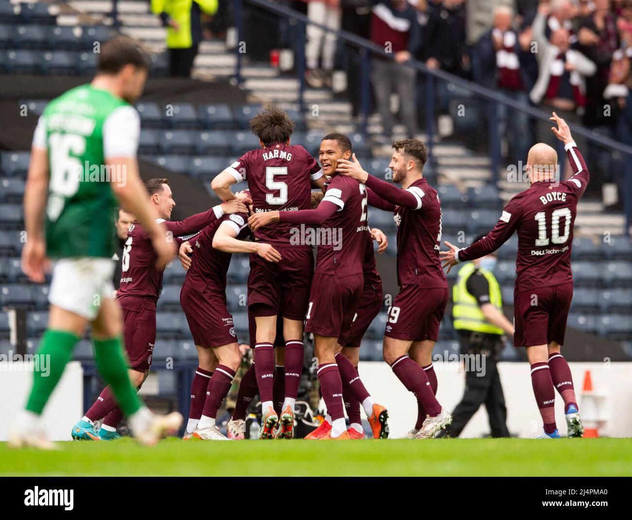 Glasgow, UK. 07th Apr, 2022. Scottish Cup semi final - Heart of Midlothian FC v Hibernian FC 07/04/2022 Pic shows: Hearts' left-back, Stephen Kingsley, is mobbed by teammates after putting his side 2-0 ahead in the 21st minute as Hearts take on Hibs in the Scottish Cup semi final at Hampden Park, Glasgow Credit: Ian Jacobs/Alamy Live News Stock Photo