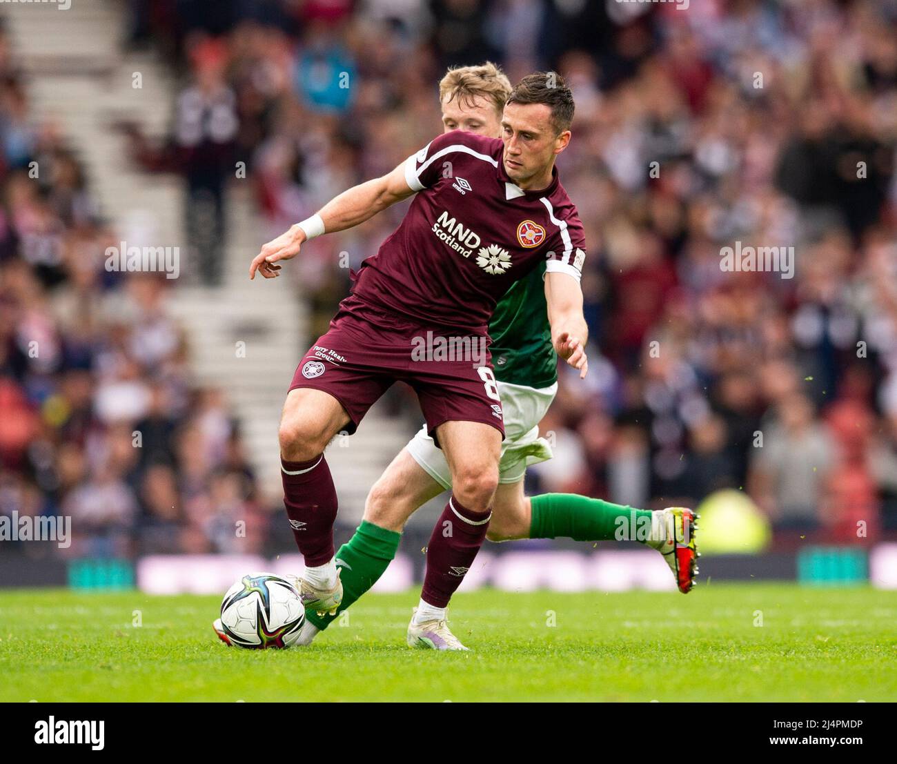 Glasgow, UK. 07th Apr, 2022. Scottish Cup semi final - Heart of Midlothian FC v Hibernian FC 07/04/2022 Pic shows: Hearts' Irish midfielder, Aaron Mceneff, gets the ball under control as Hearts take on Hibs in the Scottish Cup semi final at Hampden Park, Glasgow Credit: Ian Jacobs/Alamy Live News Stock Photo