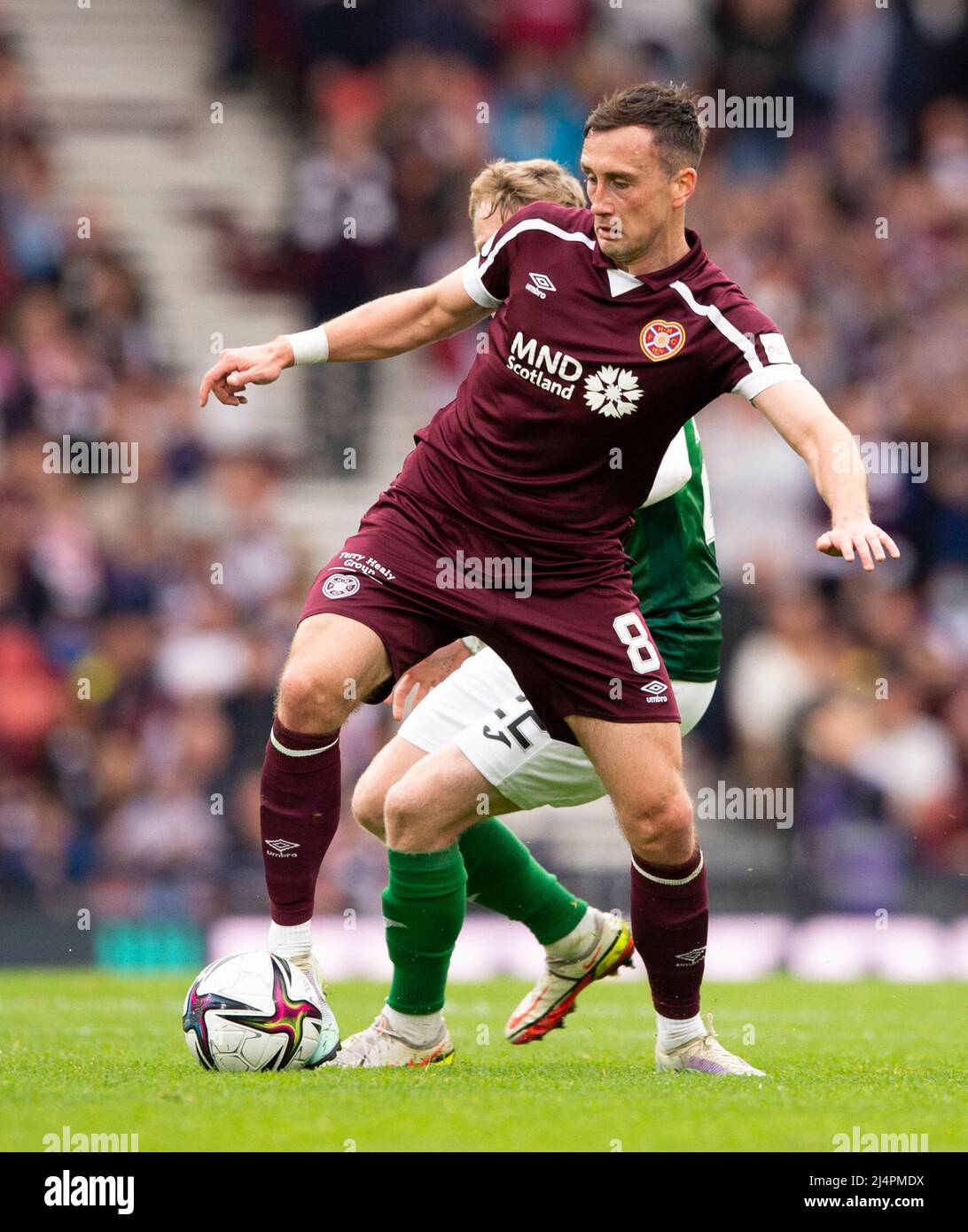 Glasgow, UK. 07th Apr, 2022. Scottish Cup semi final - Heart of Midlothian FC v Hibernian FC 07/04/2022 Pic shows: Hearts' Irish midfielder, Aaron Mceneff, gets the ball under control as Hearts take on Hibs in the Scottish Cup semi final at Hampden Park, Glasgow Credit: Ian Jacobs/Alamy Live News Stock Photo