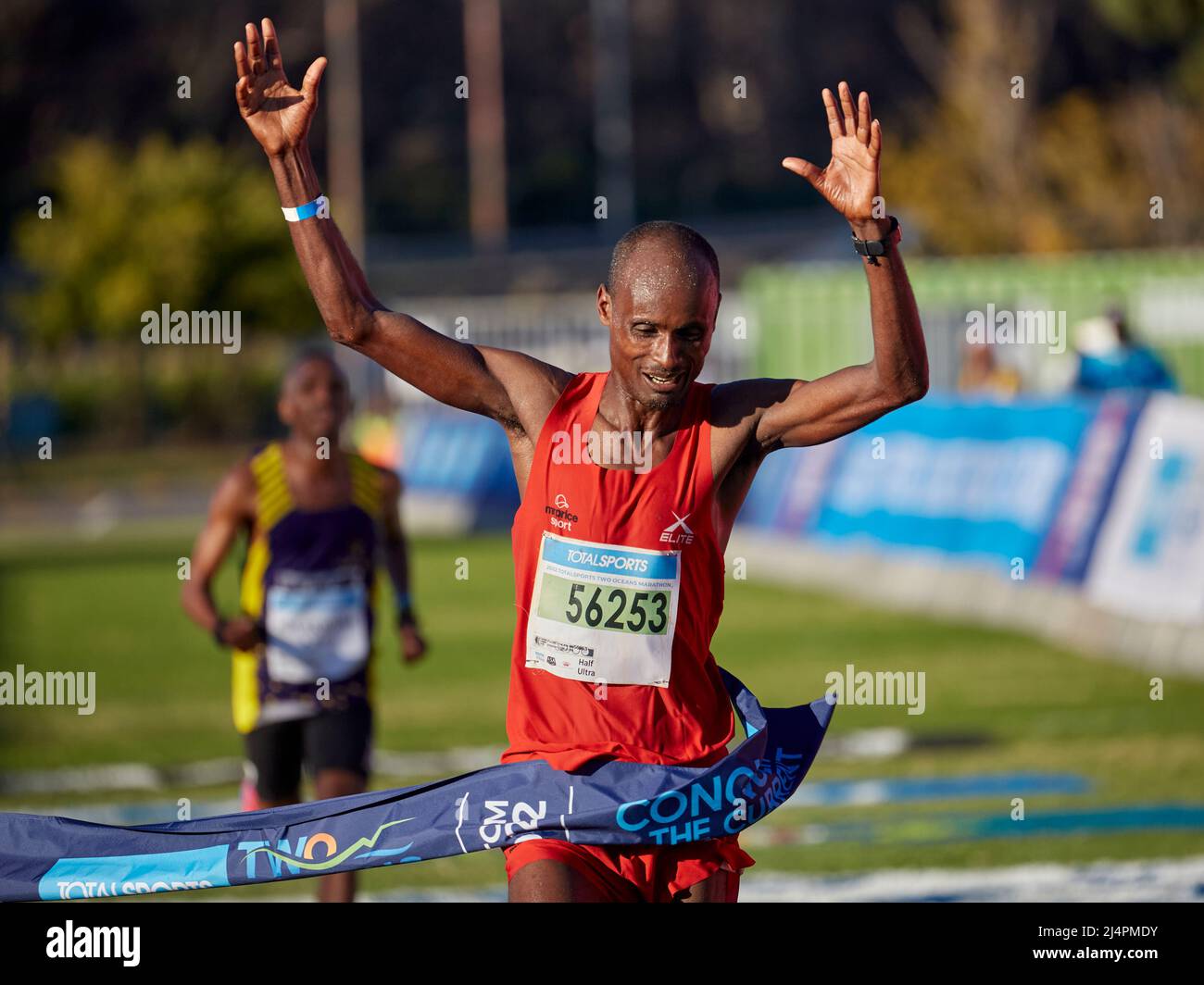 Cape Town, South Africa, 16th Apr 2022. Edndale Belachew, Mens Winner crosses the ahead of Nkosikhona Mhlakwana, in a sprint finish to the end. MO Bassa/Alamay Live News Stock Photo