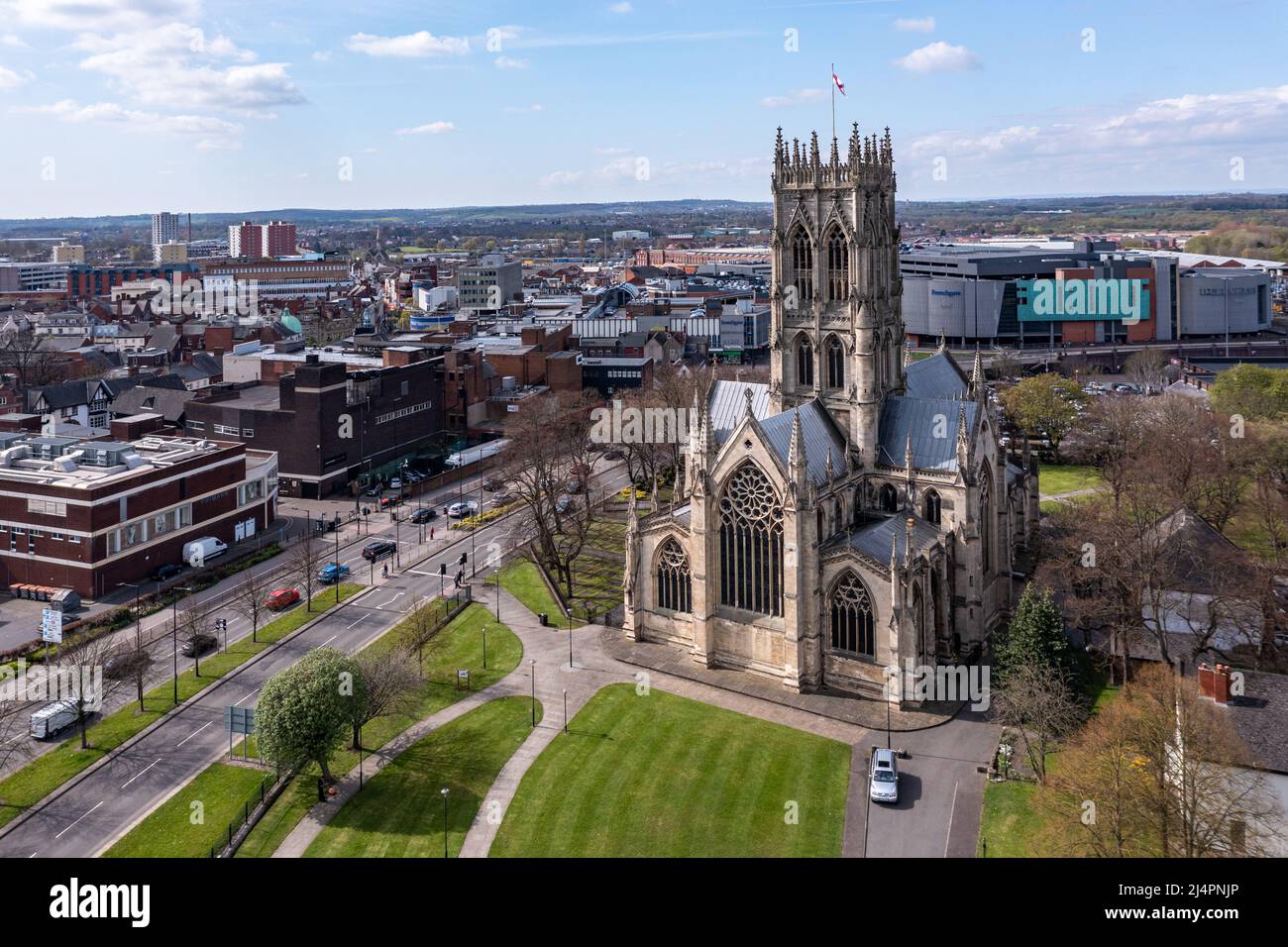 An aerial landscape view of The Minster Church of St George in a  Doncaster town centre cityscape with the Frenchgate centre shopping mall Stock Photo