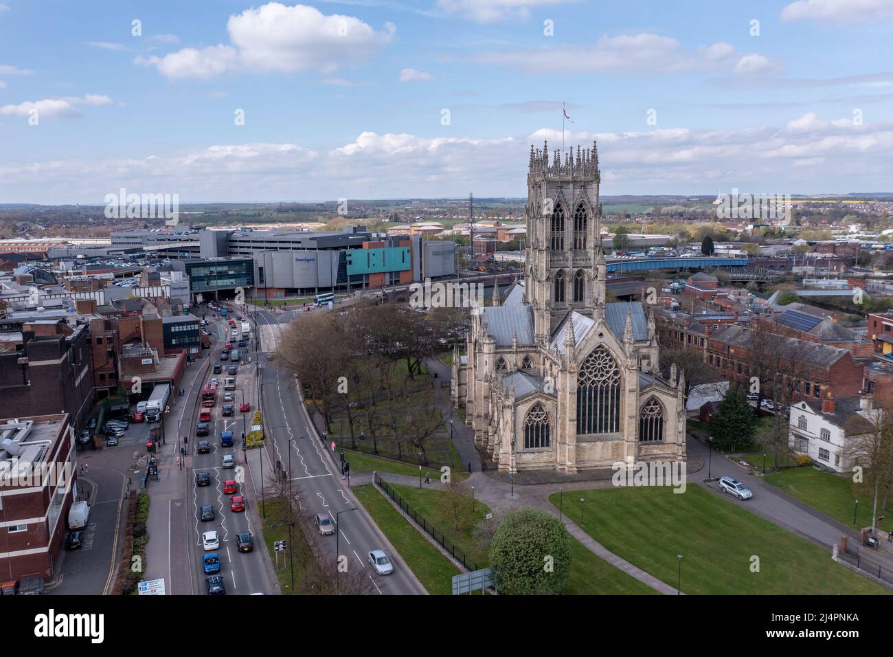 An aerial landscape view of The Minster Church of St George in a  Doncaster town centre cityscape with the Frenchgate centre shopping mall Stock Photo