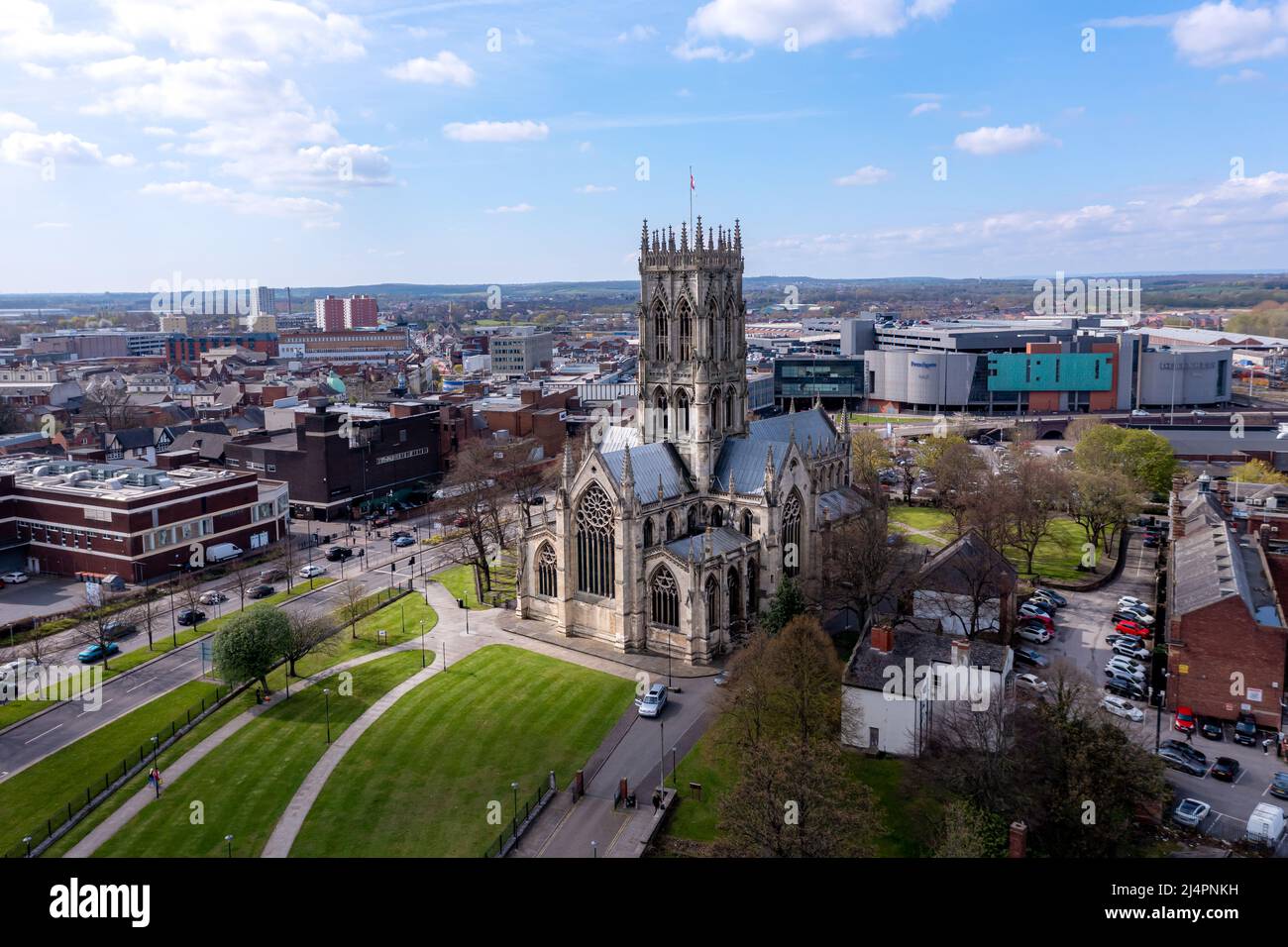 An aerial landscape view of The Minster Church of St George in a  Doncaster town centre cityscape with the Frenchgate centre shopping mall Stock Photo