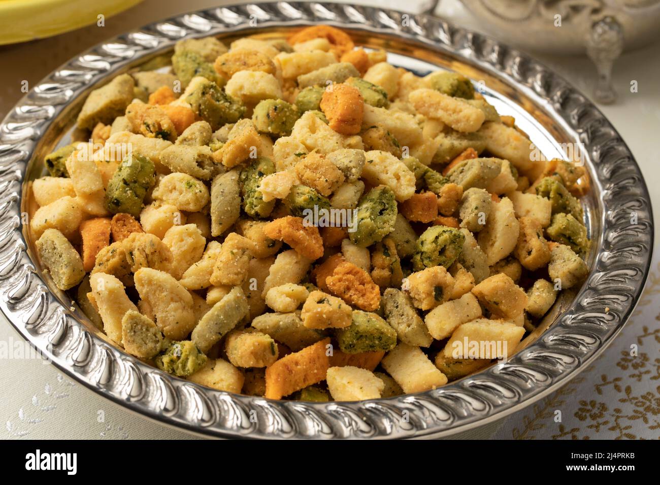 Metal bowl with colorful Moroccan crunchy miniature shortbread cookies called Krichlate for Ashura close up Stock Photo