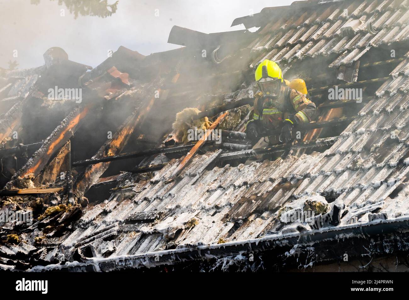 Berlin, Germany. 17th Apr, 2022. A firefighter is on duty in the attic of a nursing home in Wilhelmstadt in the Spandau district of Berlin after a fire broke out. Credit: Christoph Soeder/dpa/Alamy Live News Stock Photo