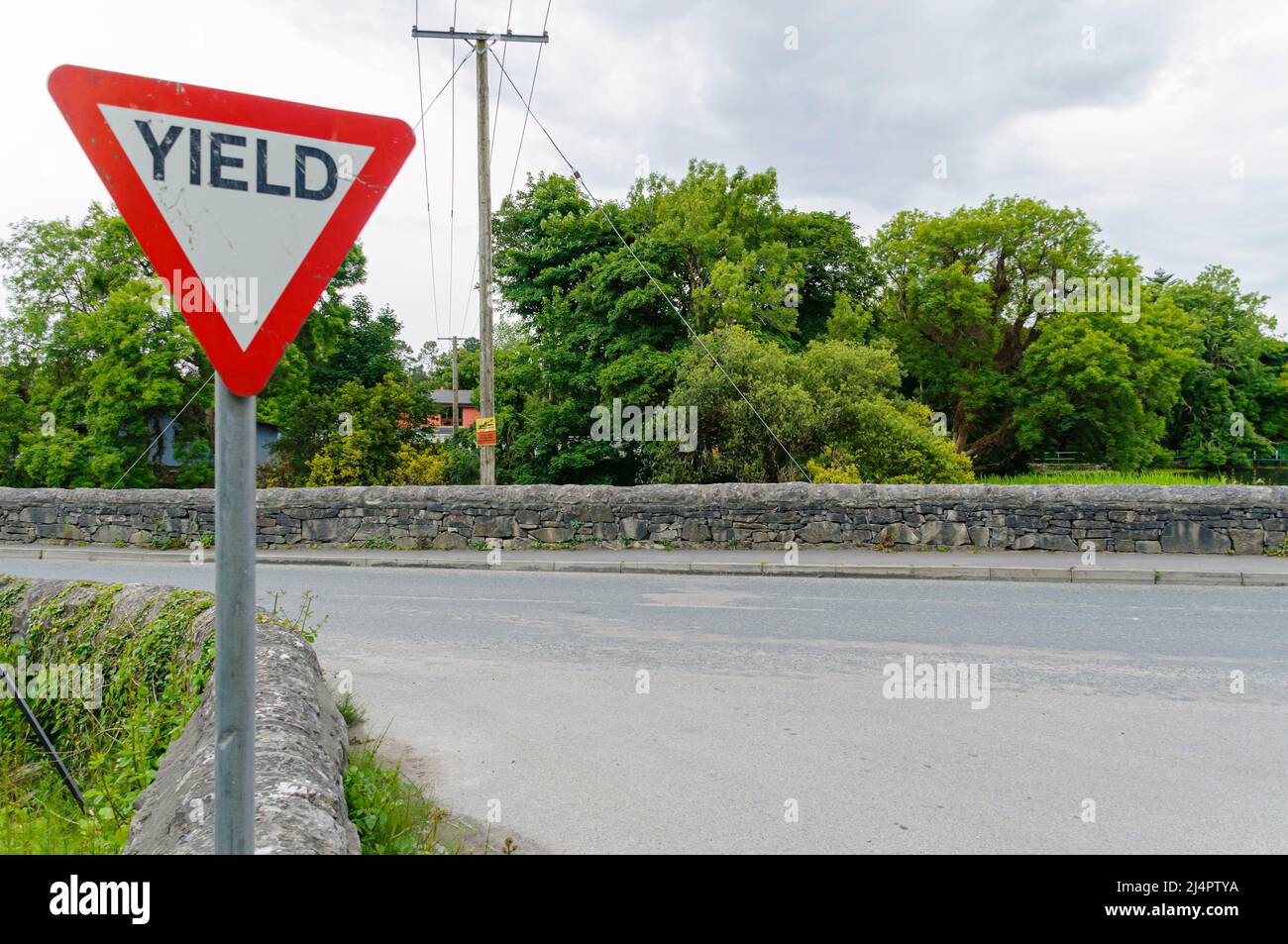 'Yield' (give way) sign at a road junction in an Irish town. Stock Photo