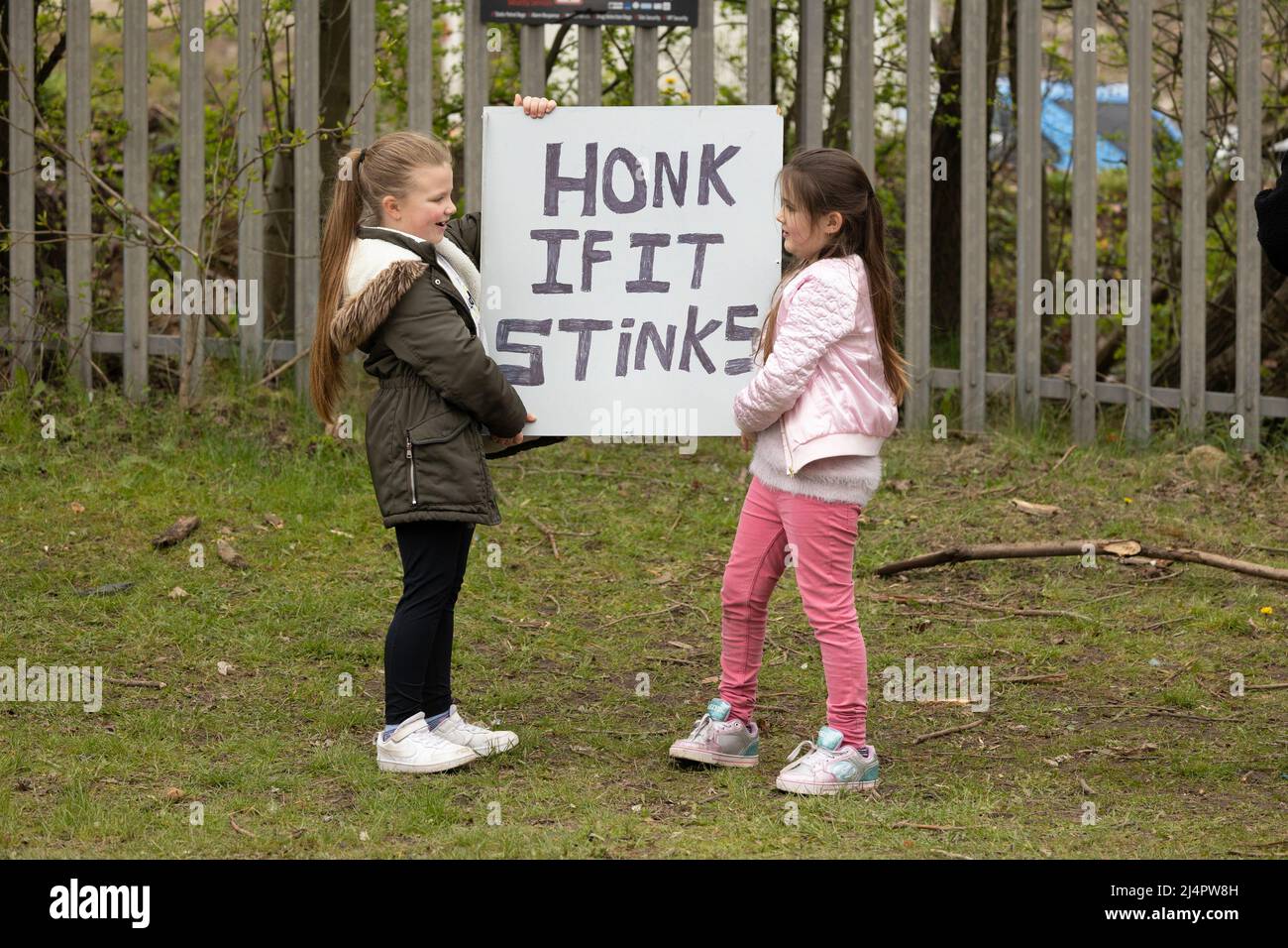 children holding banners protesting outside of walleys quarry waste landfill site Silverdale ,Staffordshire .Stop the stink campaign Stock Photo