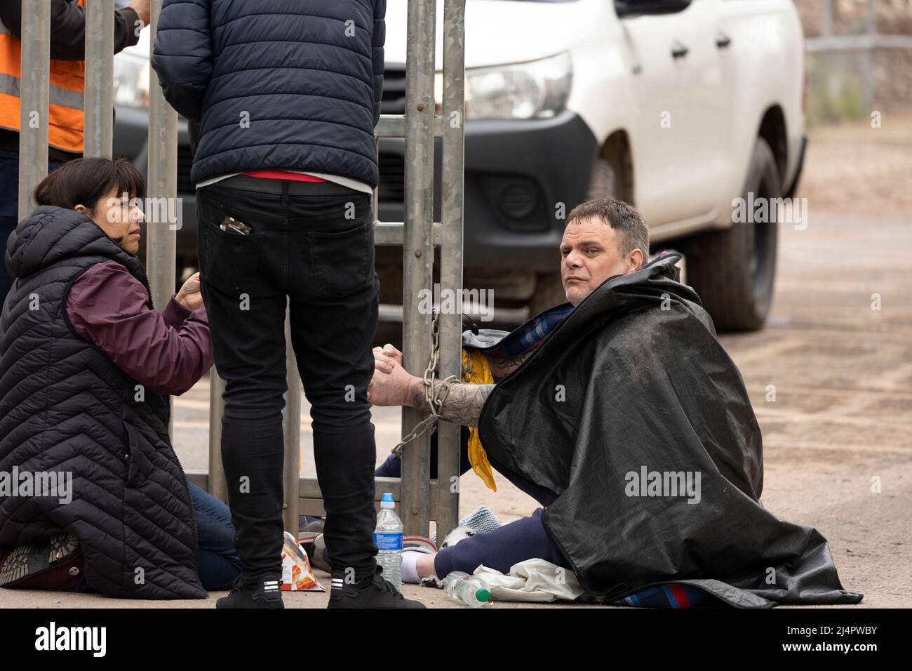 a desperate protester chains himself to the gates of whalleys quarry