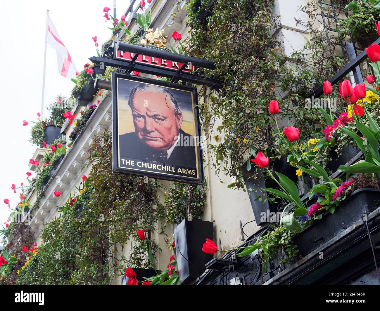 View of The Churchill Arms in Notting Hill due to its floral displays is often known as London's most colourful pub Stock Photo