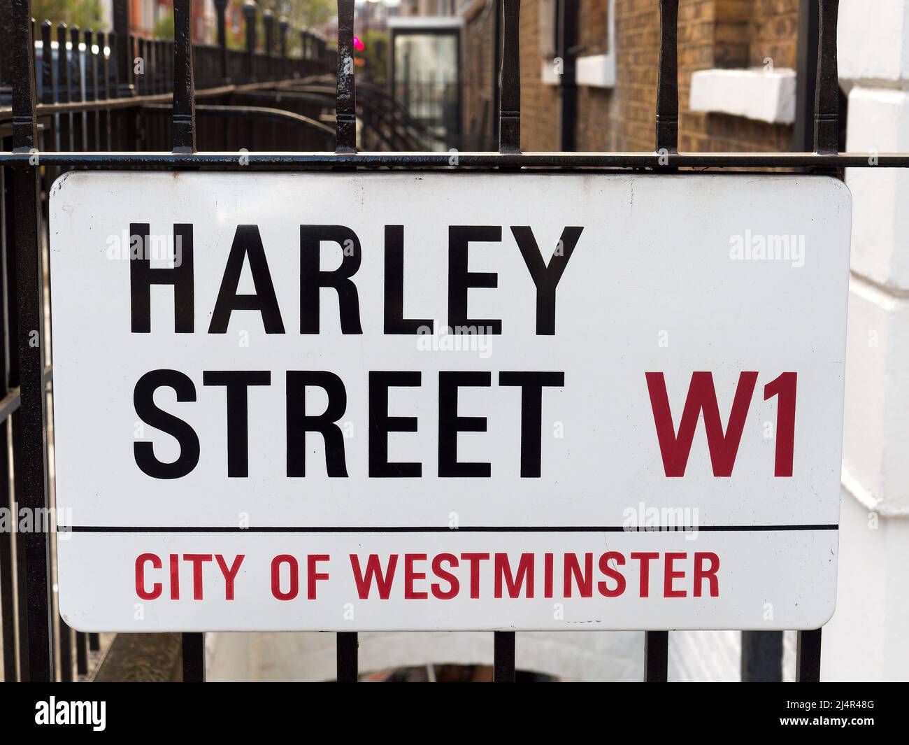 Close-up view looking up at a street sign in Harley Street in London UK Stock Photo