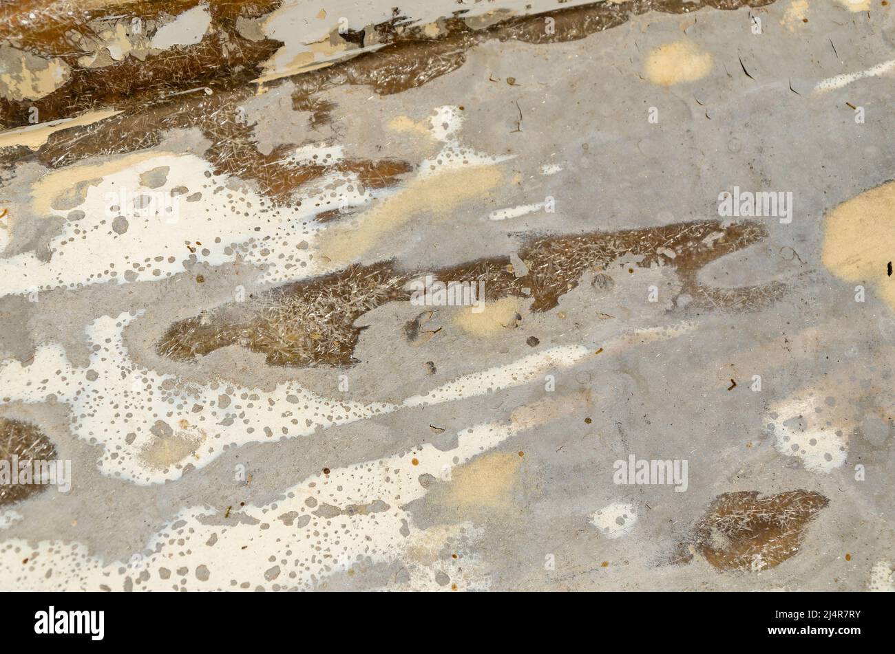Background with grey, white, and brown rough surfaces - close-up Stock Photo