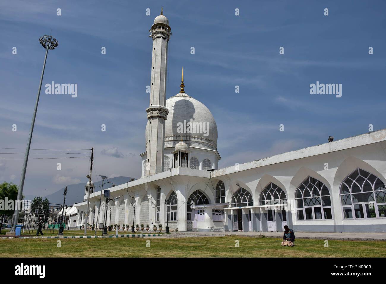 A Kashmiri Muslim offers noon prayers at the Hazratbal Shrine during