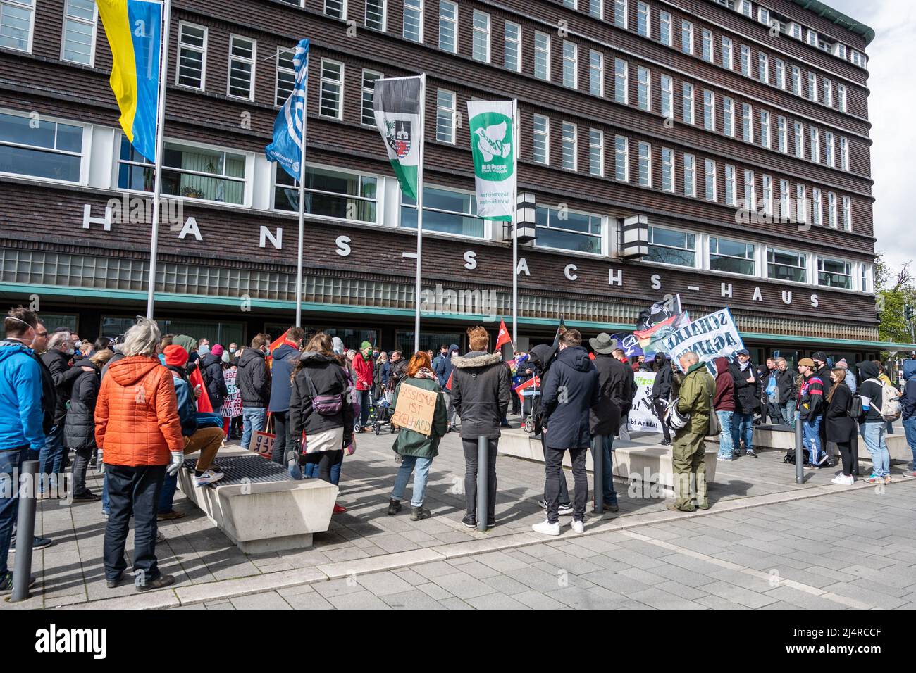 Gelsenkirchen, Germany. 09th Apr, 2022. Demonstrators stand in front of the town hall on the sidelines of the AfD's election campaign kick-off in North Rhine-Westphalia. The state elections in NRW will be held on May 15. Credit: Caroline Seidel-Dissmann/dpa/Alamy Live News Stock Photo