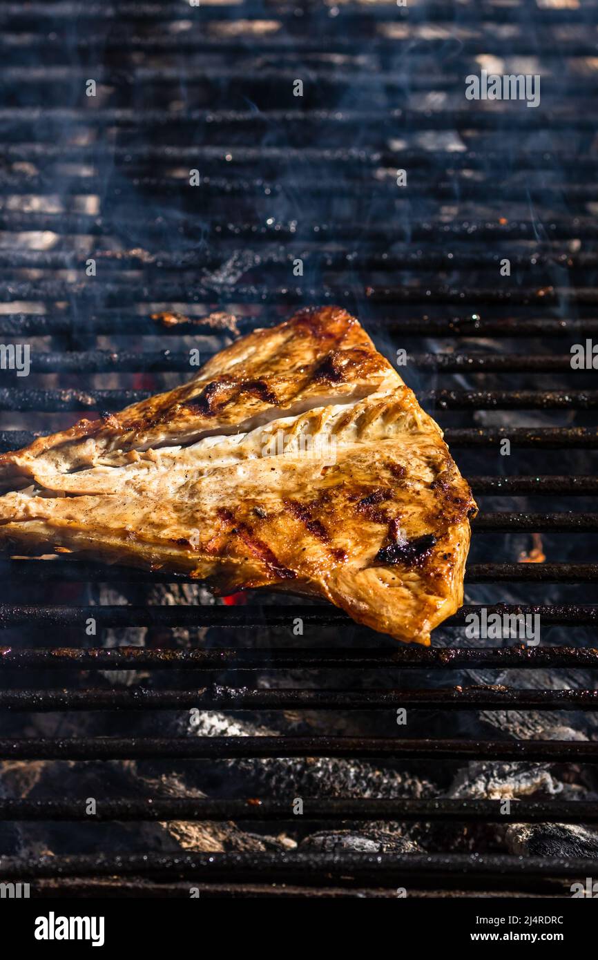 Grilled mackerel fish with smoke on a charcoal barbecue grill Stock Photo Alamy