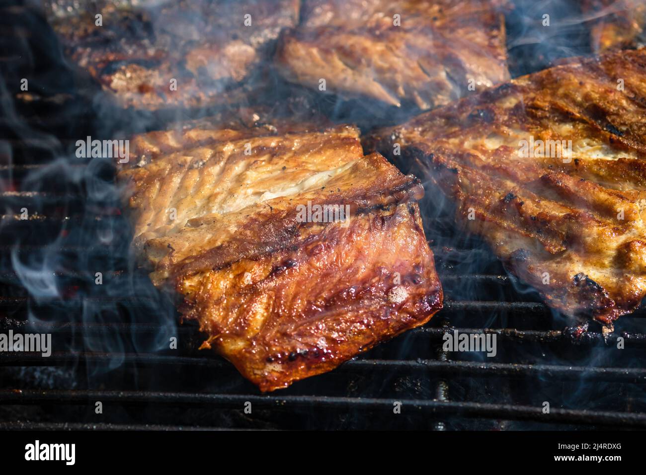 Grilled mackerel fish with smoke on a charcoal barbecue grill Stock Photo Alamy