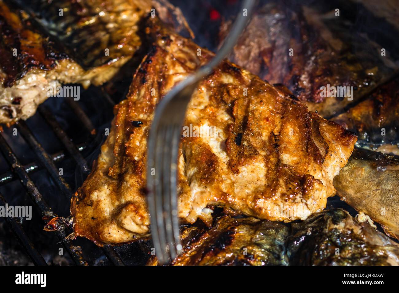 Grilled mackerel fish with smoke on a charcoal barbecue grill Stock Photo Alamy