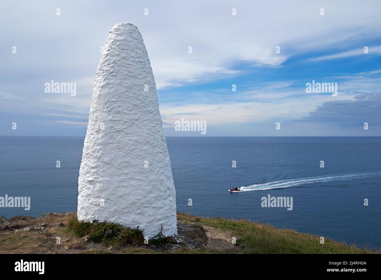 A whitewashed stone cairn marking the harbour at Porthgain, Pembrokeshire, Wales, UK. Stock Photo