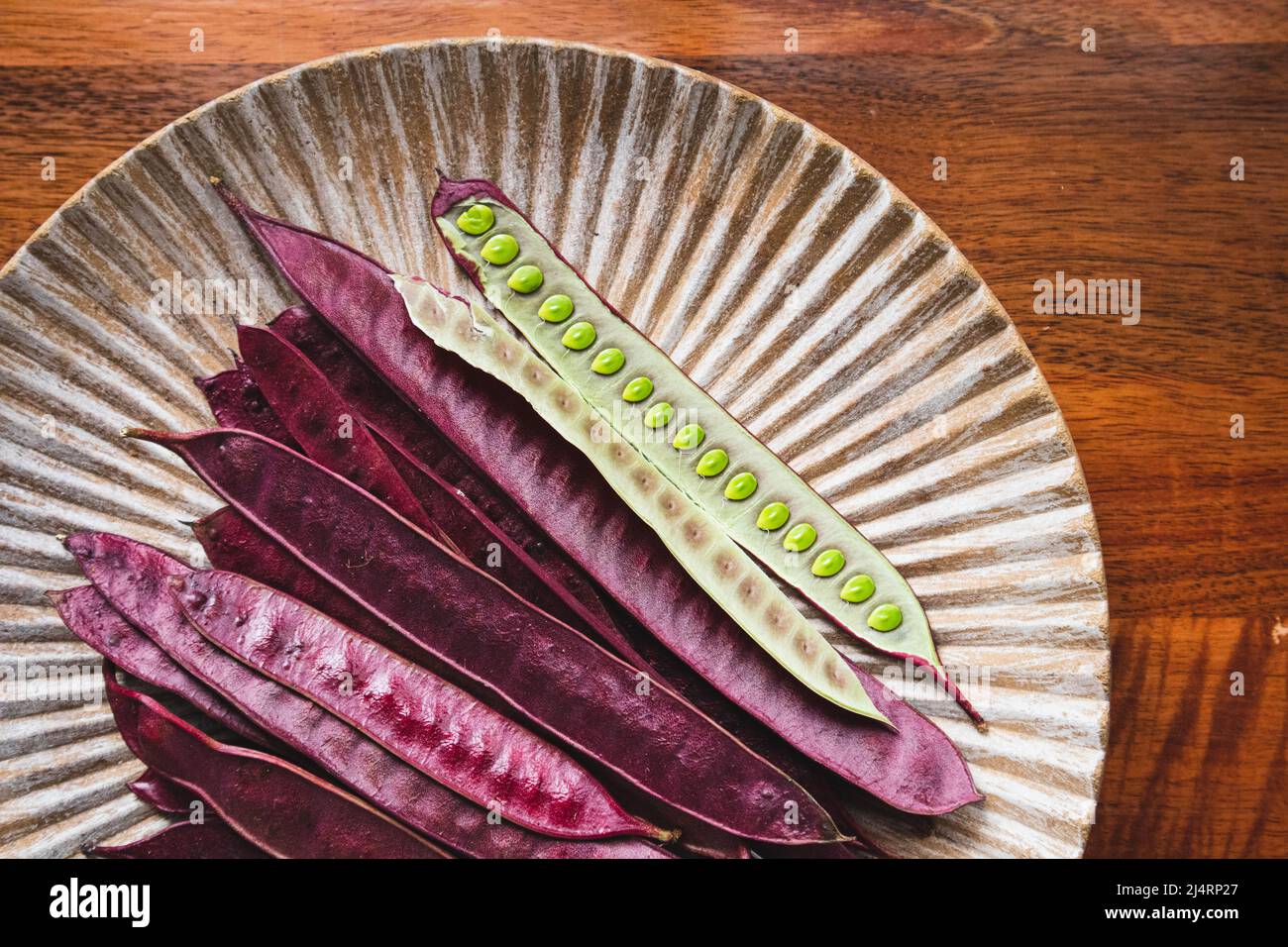 Pile of Guaje seed pods on a plate in Oaxaca, Mexico Stock Photo