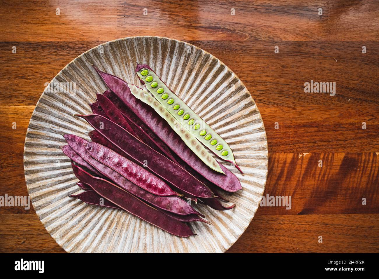 Pile of Guaje seed pods on a plate in Oaxaca, Mexico Stock Photo