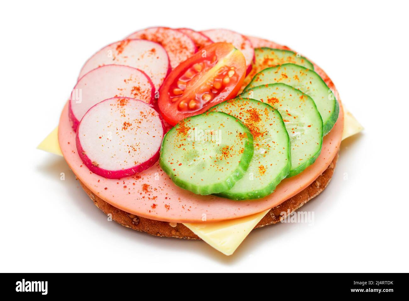 Crispy Cracker Sandwich with Fresh Cucumber, Cheese, Sausage, Radish and Tomato - Isolated on White. Quick and Healthy Sandwiches. Crispbread with Tasty Filling. Healthy Dietary Snack - Isolation Stock Photo