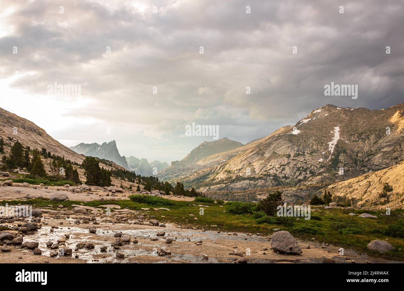 Scenic view of a mountainous valley after a hail storm on a summer day in the Wind River mountain range, Wyoming, USA Stock Photo