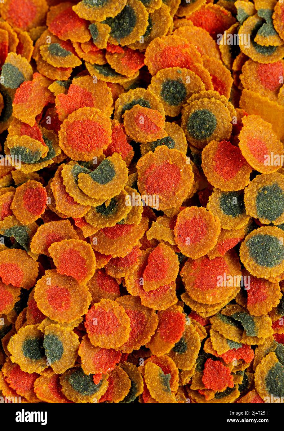 Dry colorful flakes compound fish feed flakes. Top view Stock Photo Alamy