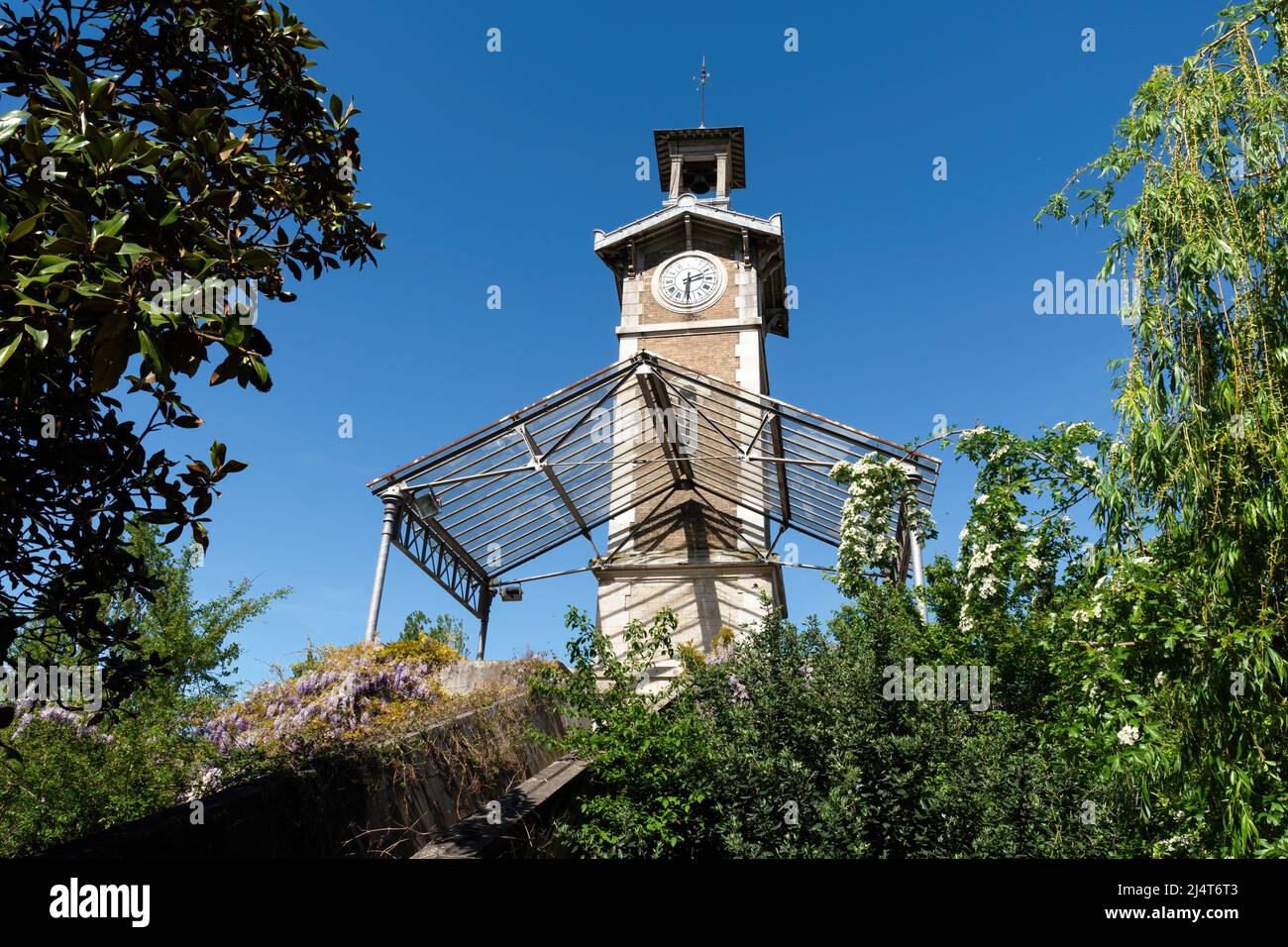 Old Clock Tower of Georges Brassens Public Park in Paris Stock Photo