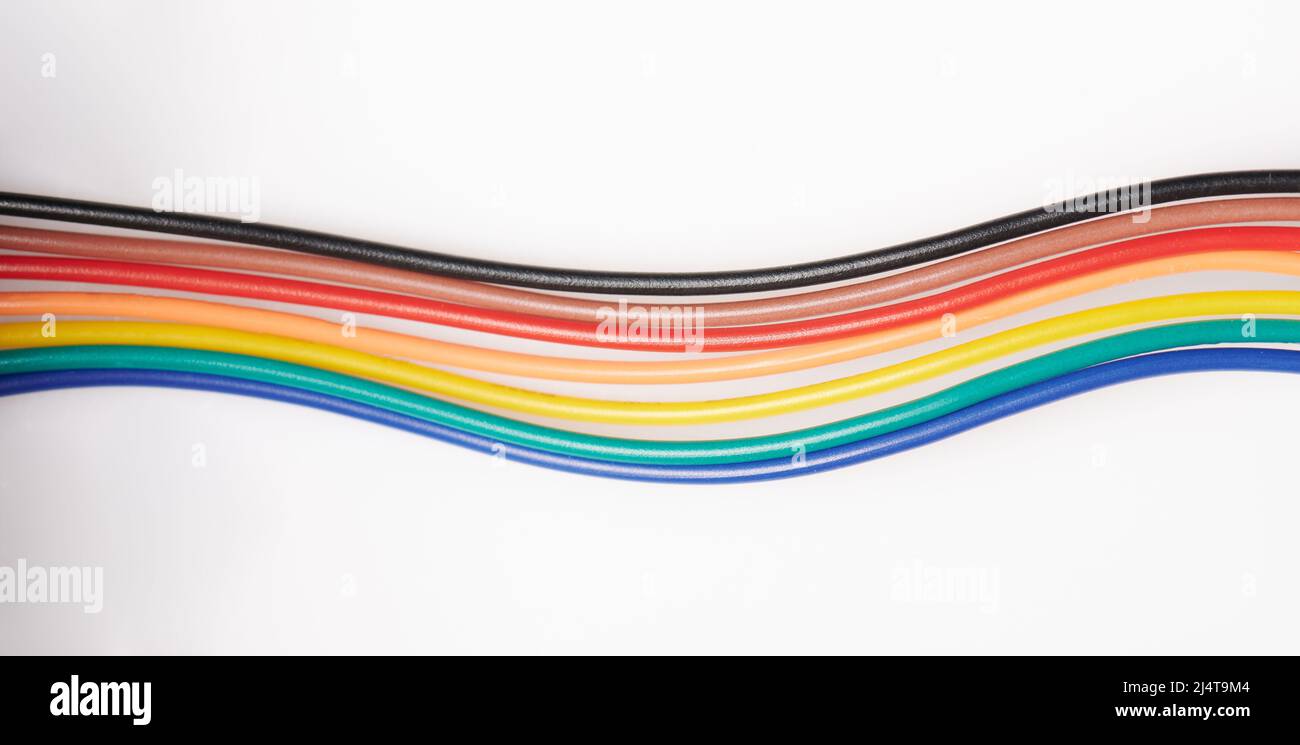 Multicolor plastic cables isolated on white studio background Stock Photo