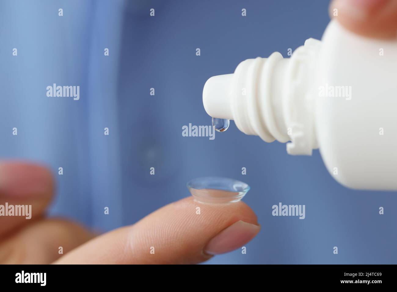 Woman with contact lenses drips moisturizing solution Stock Photo Alamy