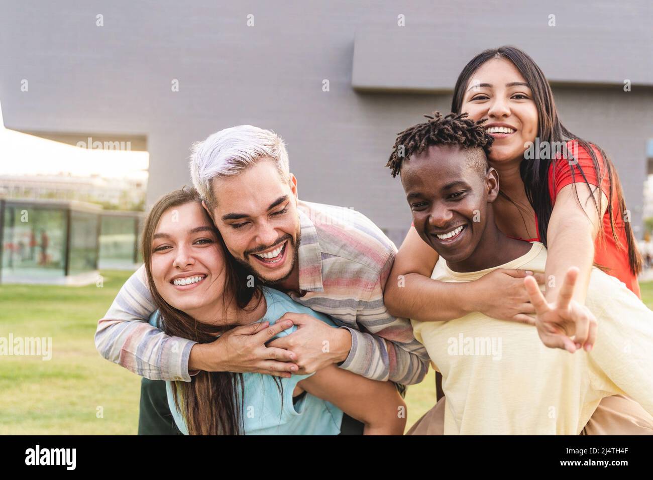 Diverse young people having fun together outdoor - Diversity lifestyle concept - Focus on gay man face Stock Photo