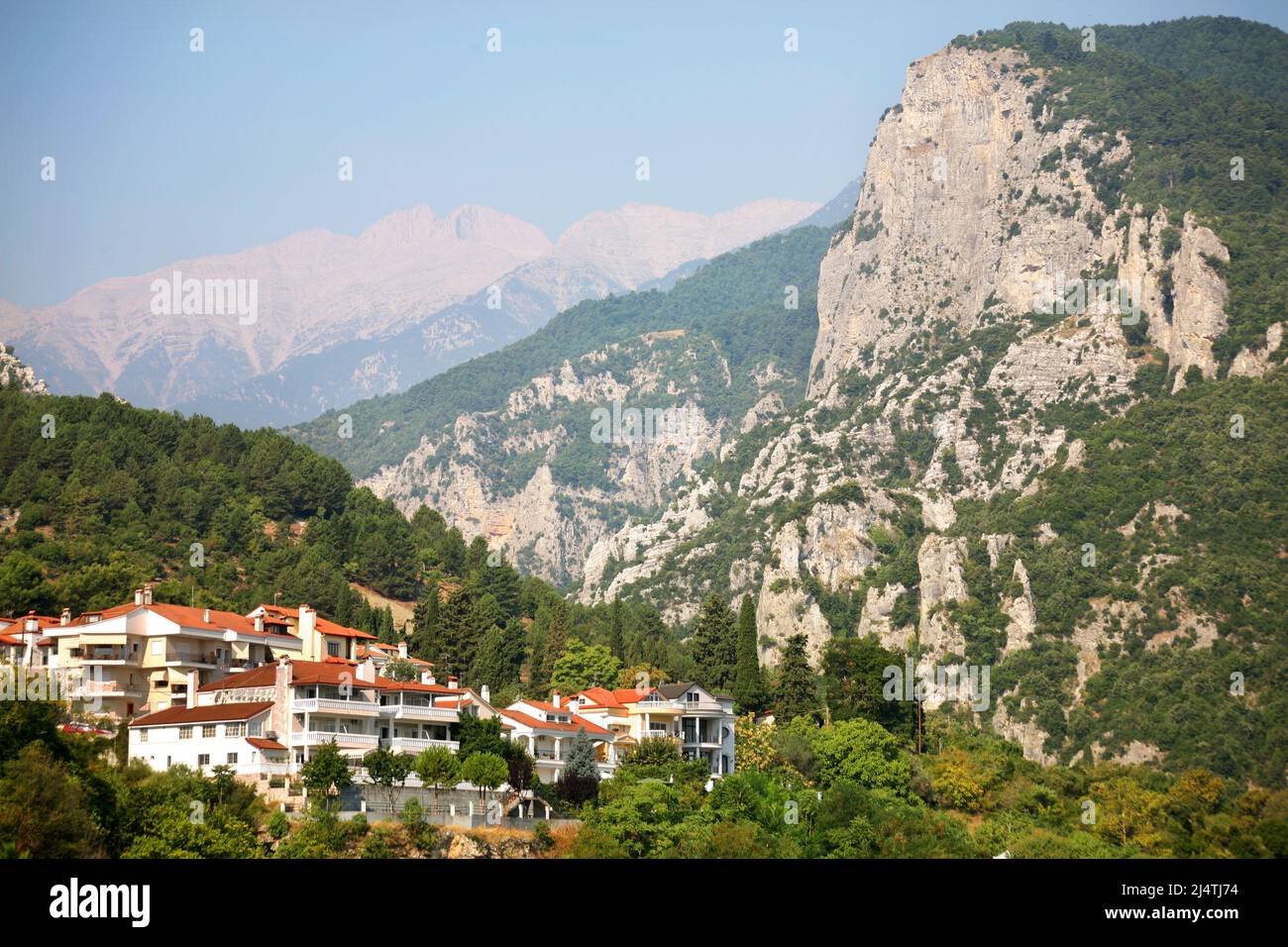 Small town Litochoro, beneath the Mount Olympus in Greece. Litochoro is last village before climbing Mount Olympus. Stock Photo