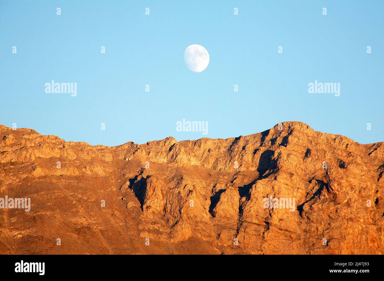 Mount Olympus mountain range and moon at sunset in Greece Stock Photo