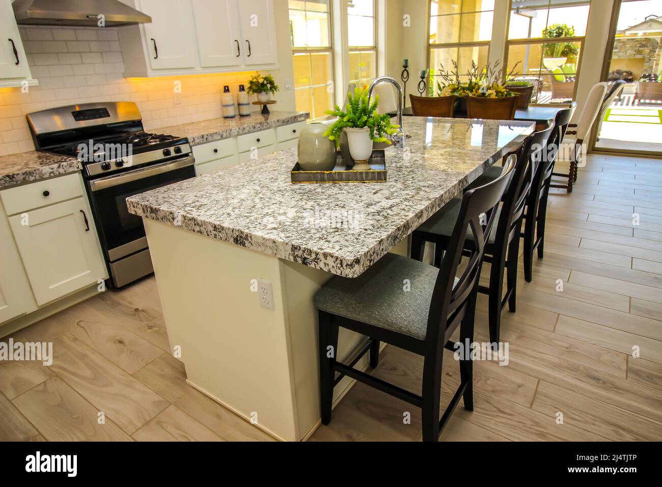 Modern Kitchen Island With Granite Counter Top Stock Photo Alamy