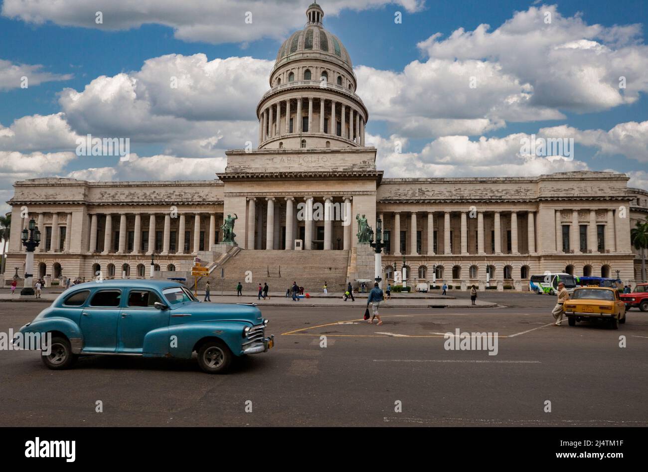 Cuba, Havana.  Capitol Building, dedicated 1929. Old American Car on the Paseo de Marti. Stock Photo