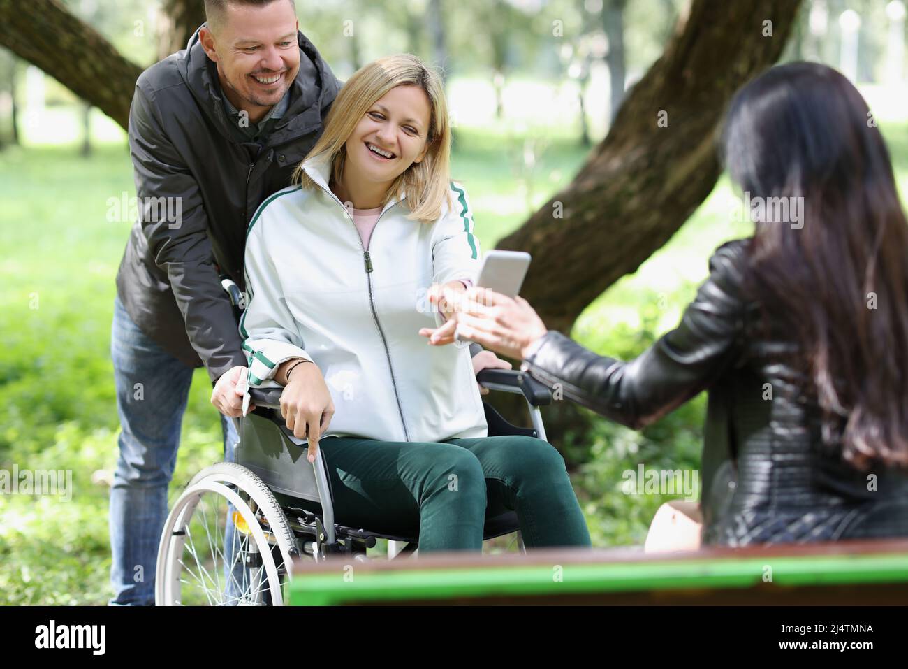 Friends happy group wheelchair hi-res stock photography and images - Alamy