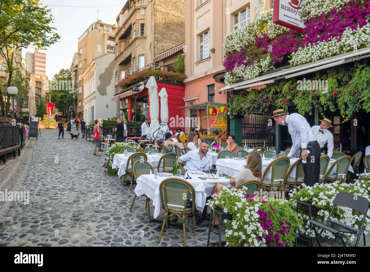 Cozy outdoor restaurant in Belgrade city center in summer, Serbia Stock Photo