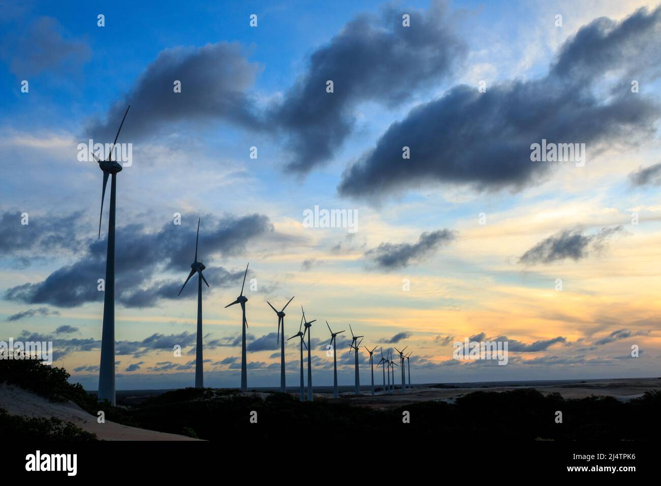 wind farm at sunset. several wind turbines Stock Photo